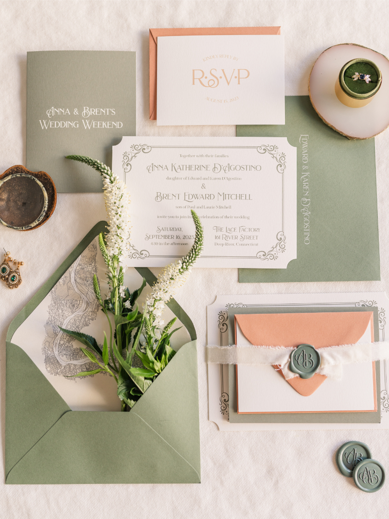 GREEN AND PEACH WEDDING INVITATION SUITE FLAT LAY