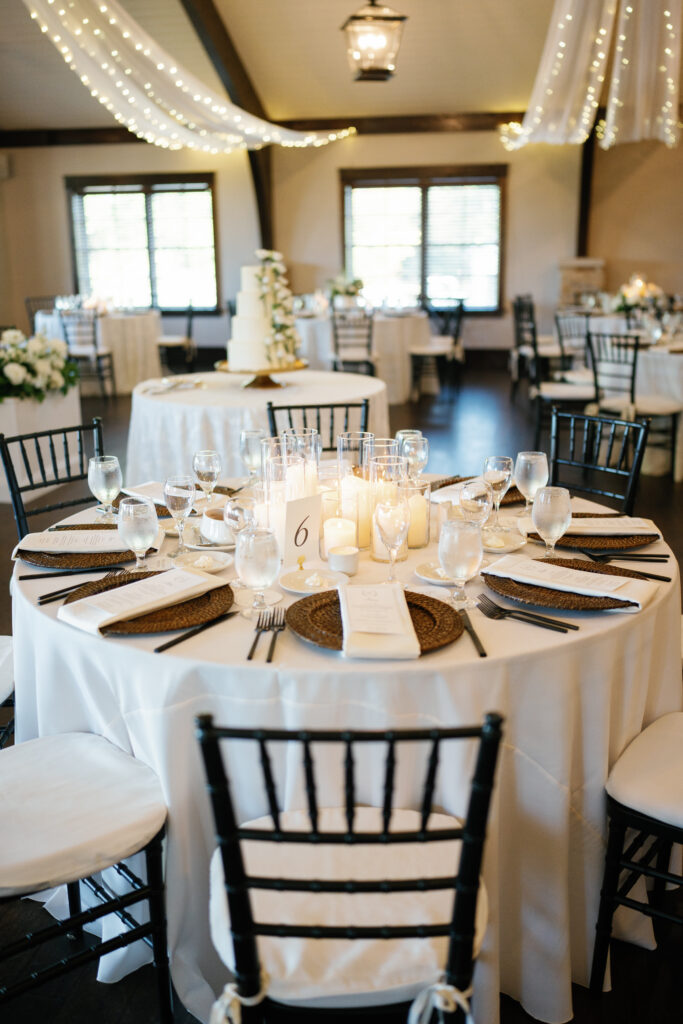 Candlelit tables filled the Manor House reception space, creating a warm, romantic glow for guests.